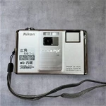 Nikon Coolpix S1000PJ Digital Camera Silver Black Built-in Projector 5X Zoom Used. Price: $109.00.